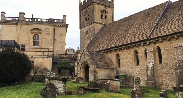 Cowley Church and Manor, including a portion of the grassy graveyard arouund the church.